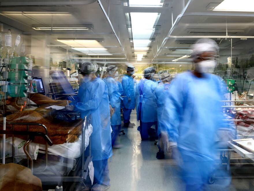 Health workers care for COVID patients at the emergency room of the Nossa Senhora da Conceição hospital on March 11. In more than half of Brazil's 26 states, ICU occupancy rates have hit 90% or above during the pandemic.