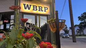 flowers in front of a store front 