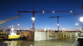 Work lights shined above the bustling site of the SR 520 Pontoon Construction Project during the first float-out on July 30, 2012.