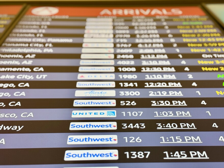 The arrivals board at ABIA showing a number of different flights from airlines like Southwest, United and Delta
