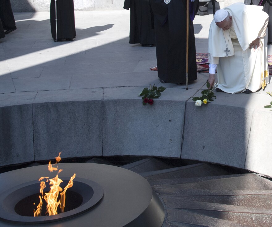 Pope Francis places flowers during his visit to Tzitzernakaberd Memorial Complex in Yerevan, Armenia, on Saturday.