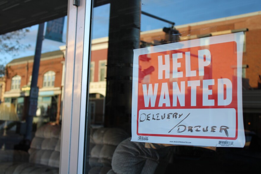 A help wanted sign in the window of Gary's Furniture and Appliance in downtown Presque Isle.