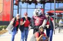 SIU's mascot Grey Dawg helps celebrate the opening of Raising Cane's