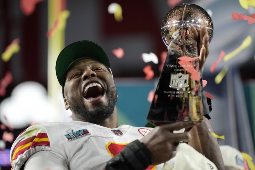 Kansas City Chiefs defensive end Carlos Dunlap celebrates with the Vince Lombardi Trophy after the NFL Super Bowl 57 football game, Sunday, Feb. 12, 2023, in Glendale, Ariz. The Kansas City Chiefs defeated the Philadelphia Eagles 38-35.
