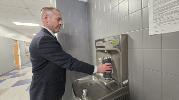 Lakeland School District Marc Wyandt fills his water bottle in the high school. A filter in the fountain removes PFAS chemicals from the drinking water.