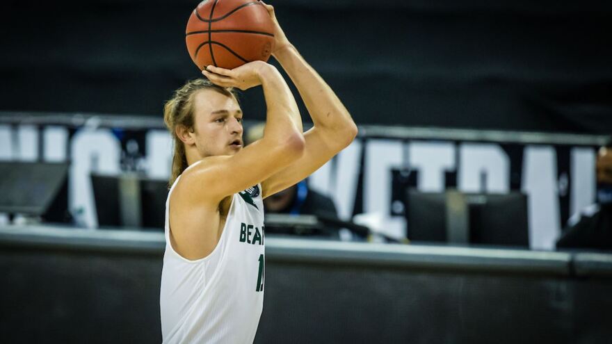 Action shot of Diego Bernard vs Pittsburg State basketball