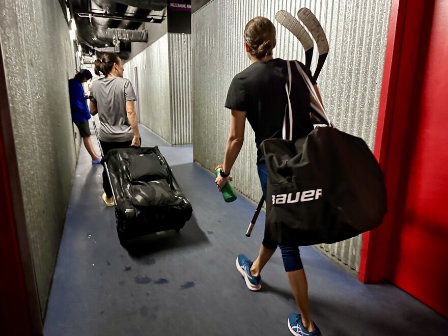 Members of the Lucky Pucks leave the locker room after their weekly Girls Nite Out weekly game at the Florida Panthers IceDen in Coral Springs. 