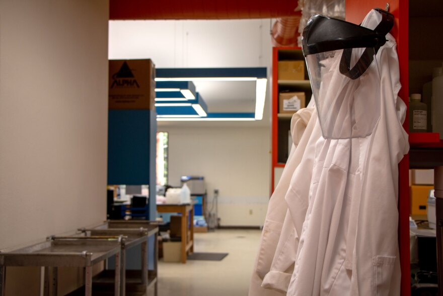 Lab coats hang inside the University of Montana's Flathead Lake Biological Station lab.