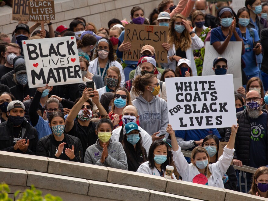 Health workers and others rallied in Seattle during a Doctors For Justice event on June 6, protesting police brutality in the wake of George Floyd's death. Medical training needs a hard look too, doctors say: Students of color and LGBTQ people often bear the brunt of what can be a bullying culture.