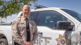 Weber County Sheriff Ryan Arbon stands next to a patrol vehicle outside the sheriff's office in Ogden, Aug. 25, 2026