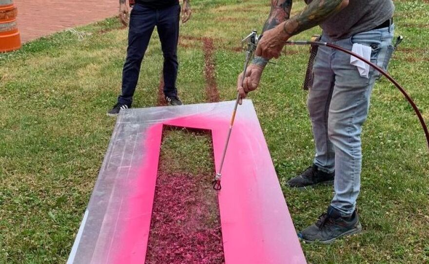 A crew from the museum helped spray paint onto the lawn according to Thalhammer's design.