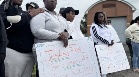 Demonstrators hold handmade signs outside Women Huron Valley correctional facility. One sign reads "Justice For The Women At Huron Valley" and another reads "THEY CAN NOT SPEAK SO WE ARE THEIR VOICE !!!". 