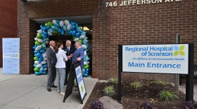 Democratic state Rep. Bridget Kosierowski (center) and state Sen. Marty Flynn (left) speak with Commonwealth Health president Michael Clark (center right) and Regional and Moses Taylor Hospitals CEO Dr. Patrick Conaboy (right) after Monday's ribbon cutting at Regional Hospital of Scranton.