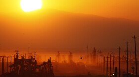 The sun rises over an oil field over the Monterey Shale formation where gas and oil extraction using hydraulic fracturing, or fracking, is on the verge of a boom on March 24, 2014 near Lost Hills, California. (David McNew/Getty Images)