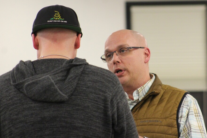 Aurora Borealis Charter School Academic Policy Committee Chair Daniel Mahr (left) talks to School Board President Jason Tauriainen on Monday, Feb. 2, 2026 in Soldotna, Alaska.