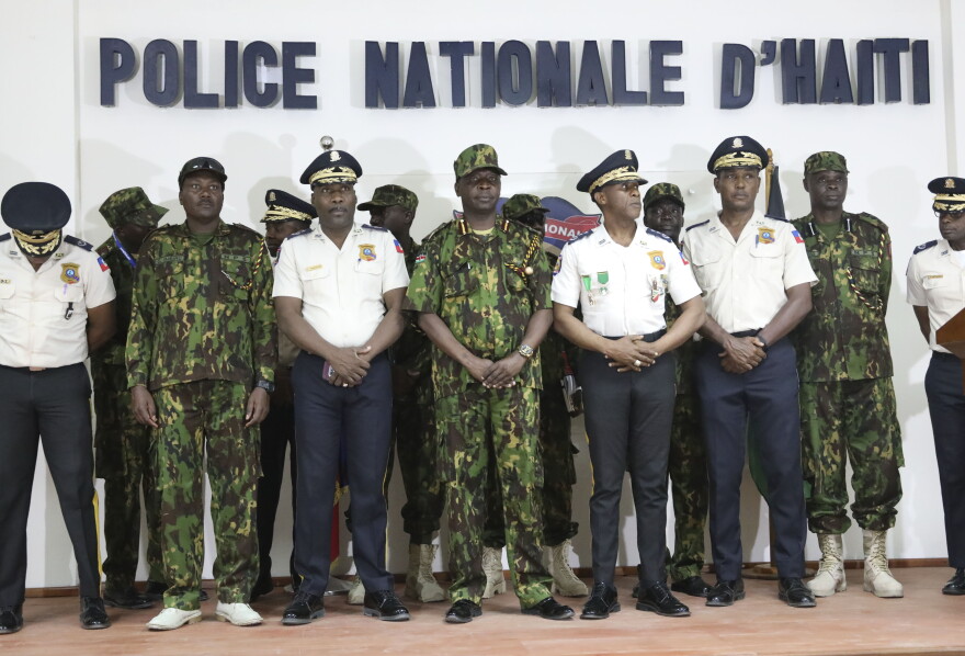 Haitian police and members of a UN-backed Kenyan police force pose for photo after a press conference at the police headquarters in Port-au-Prince, Haiti, Monday, July 8, 2024. 