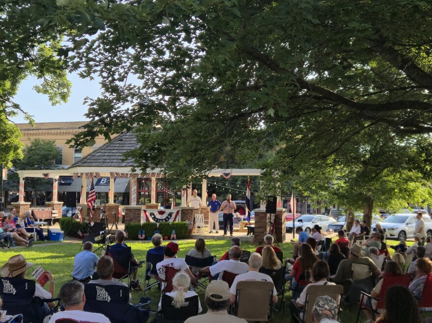 Candidates Jered Taylor and Terry Bible took turns addressing the crowd on the Ozark courthouse lawn during a forum put on by the Christian County Headliner News.