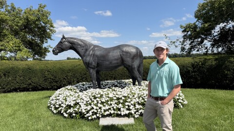Lane's End's Will Farish stands in front of the AP Indy statue on the farm