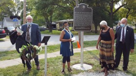 William Furry of the Illinois State Historical Society, Vivian's daughters Denise Morse and Jo Anna Walker, and Mayor Mike Inman (left to right) unveiled the historical marker.