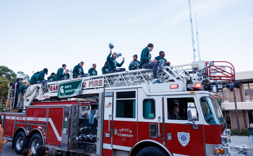 The Michigan State University men's basketball team rides a firetruck in the Michigan State University Homecoming Parade in East Lansing, Mich., on Oct. 9, 2026.