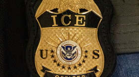 A federal agent wears an Immigration and Customs Enforcement badge in New York, June 10, 2025.