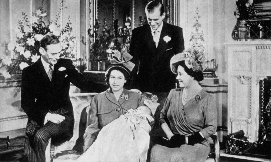 Then a princess, Elizabeth II holds her son Prince Charles while posing with her parents and husband. Charles was born on Nov. 14, 1948, and is the heir apparent to the British throne.
