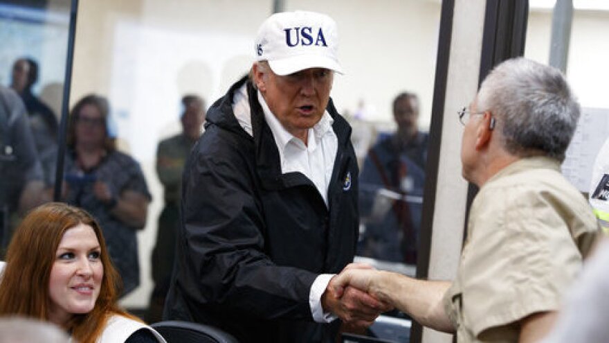 President Trump is greeted as he tours the Texas Department of Public Safety Emergency Operations Center on Tuesday in Austin.