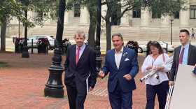 Massachusetts Secretary of State Bill Galvin (left) and Springfield Mayor Domenic Sarno in Springfield walk to a press conference. 