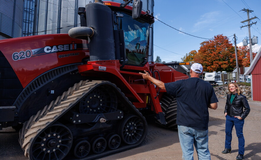 Secretary of State Jocelyn Benson, the Democratic nominee for governor, learns about farm equipment after a news conference at Shady Lodge Farm in Lansing, Mich., on Oct. 8, 2026.