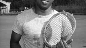 Irwin Holmes on the NC State University tennis team in 1957.