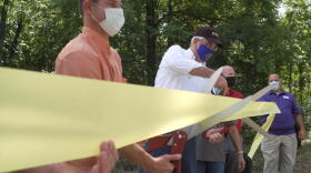 Gov. Eric Holcomb at a ribbon cutting for Ravinia State Forest.