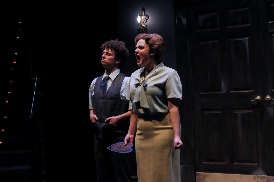 A woman screams in a dark interior