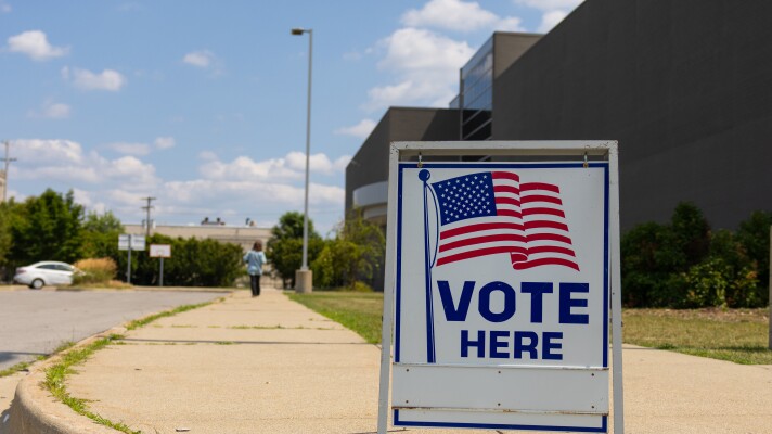 A voter makes her way inside Saginaw United high school to cast her ballot in the August 4 primary election.