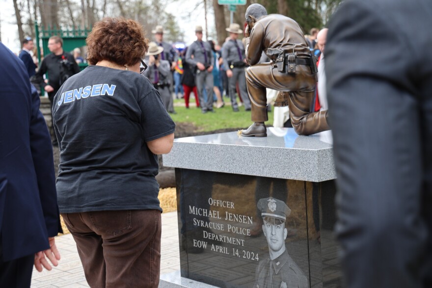 A monument dedicated to Syracuse Police officer Michael Jensen and Onondaga County Sheriff's Lieutenant Michael Hoosock was unveiled on Tipperary Hill Tuesday, April 14, 2026