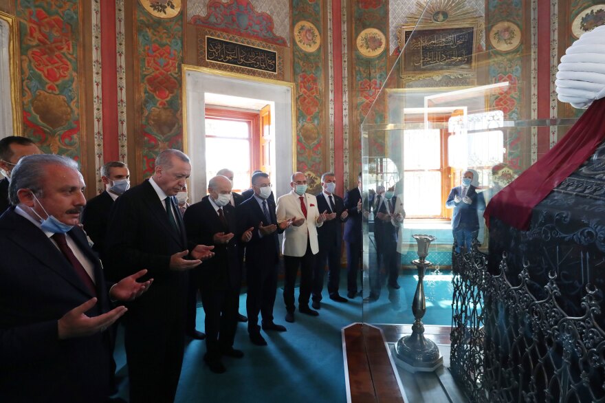 Turkish President Recep Tayyip Erdogan prays by the tomb of Mehmet the Conqueror after attending Friday prayers at Hagia Sophia.