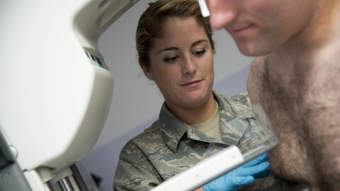 U.S. Air Force mammography technician Elisabeth Stone conducts a mammogram on a male patient at Joint Base Elmendorf-Richardson in Alaska in a 2014 file photo. 