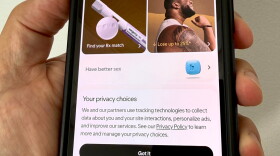 smartphone shows a website on a screen that depicts ads with a disclaimer headlined "Your Privacy Choices"