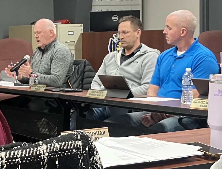 Washington City Council member Brian Butler makes a point during Monday's meeting while fellow council members Bobby Martin III (middle) and John Blundy listen.