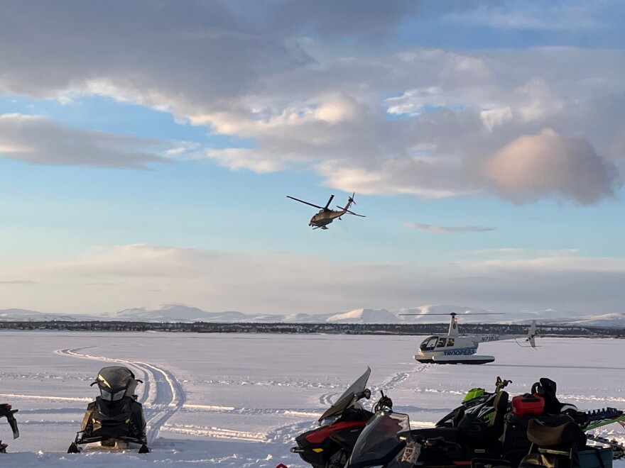 An Alaska Air National Guard Helicopter arrives at the scene of the March 5 plane crash.