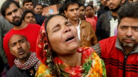 A fire that swept through a factory where laborers were sleeping on Sunday morning, killing at least 43 people. Relatives of the victims gathered outside a hospital mortuary in the city on Sunday.
