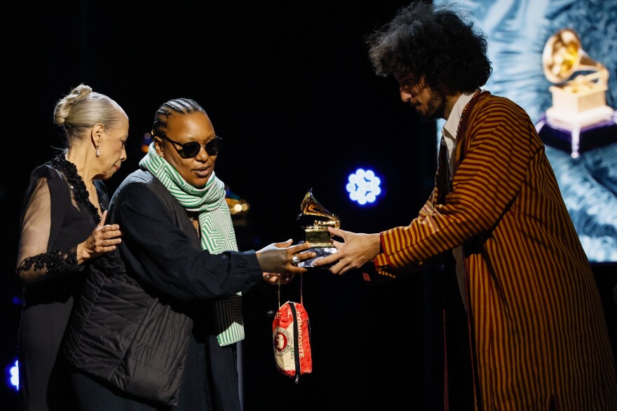 Meshell Ndegeocello, with Abraham Rounds and Patti Austin, accepting the award for Alternative Jazz Album during the 66th Grammy Awards Premiere Ceremony, at the Peacock Theater in Los Angeles on Feb. 4, 2024.