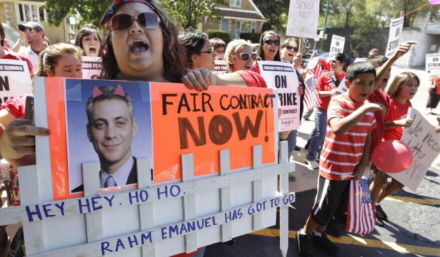 Striking Chicago Public School teacher Lanessa Mendoza pickets with fellow teachers Monday as Mayor Rahm Emanuel visits students staying at Maranatha Church in Chicago during the strike.