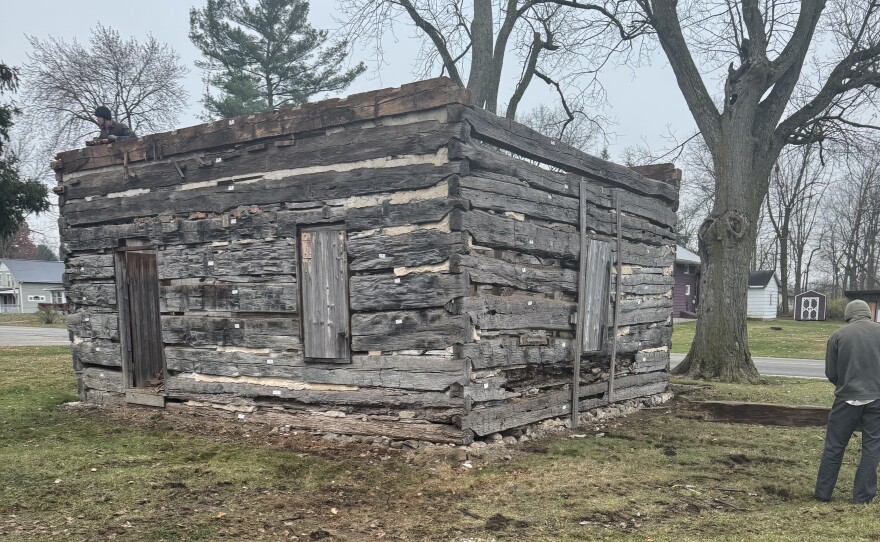 Crews dismantle the historic 1834 log cabin, tagging and removing each timber as part of Elkhart County Parks’ restoration project.