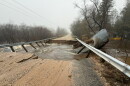 Storm damage to Johnson Road in Kaleva after rain-swollen Bear Creek twisted massive culverts and swept away the bridge. (Photo: Charlie Brooks / for the Northern Michigan Journalism Collaborative)