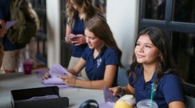 Student volunteers handed out schedules Wednesday morning, before the 8 a.m. bell.