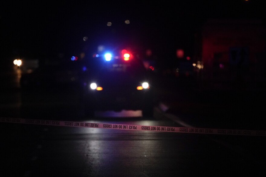 FILE: A police tape blocks the street near an office building where a shooting occurred in Orange, Calif., Wednesday, March 31, 2021.