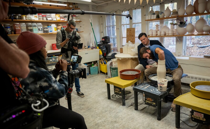 Behind the scenes of Connecticut Public's original series 'Where ART Thou?'. Left to right is crew Glenn Goettler, Ayannah Brown, Dave Wurtzel, host Ray Hardman and ceramic artist Drew Darby of Round Trip Clayworks as he demonstrates creating a piece on his pottery wheel.