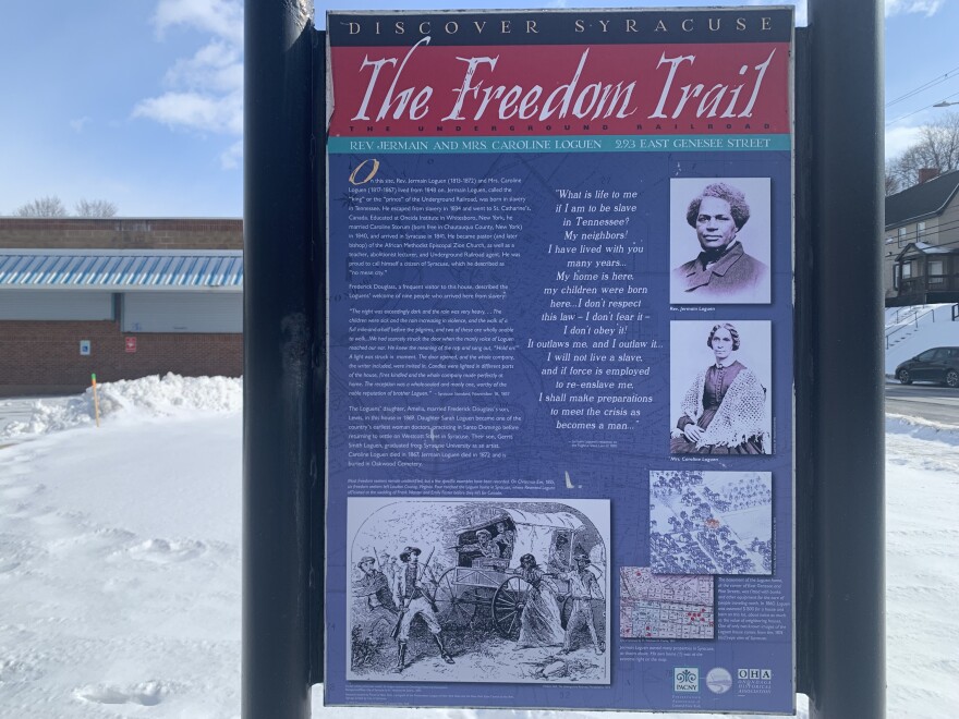 The Freedom Trail marker at the corner of 293 East Genesee Street and Pine Street in Syracuse.