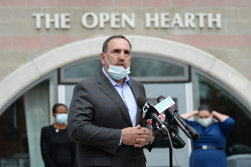 Jeffrey Flaks, president and CEO of Hartford HealthCare, addresses the media at a news conference earlier this month at The Open Hearth homeless shelter.