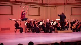 A member of the St. Louis Dance Theatre leaps across the Powell Hall stage in a performance with the St. Louis Symphony Orchestra led by Stéphane Denève, January 2026